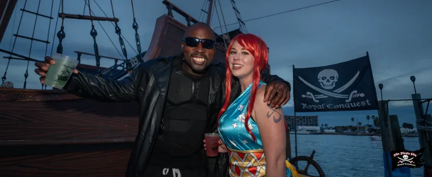 SST - A couple holding out a drink while in a costume