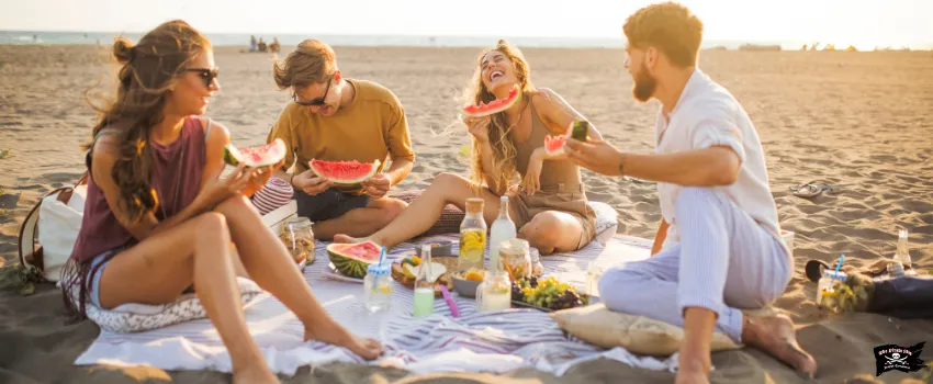 SST - A group of friends having a picnic in the beach