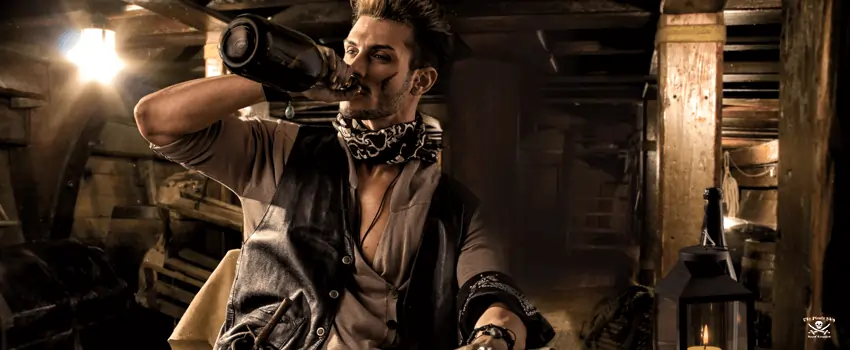 Pirate Drinking from Bottle in Ship Quarters