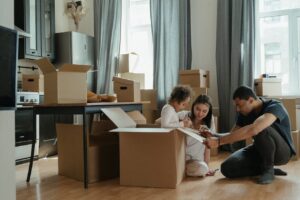 family packing moving boxes; how to pack for a move